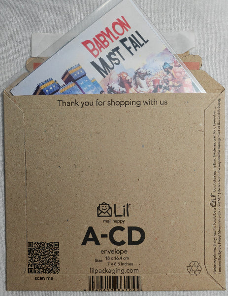 Brown envelope with a card inside featuring 'Babylon Must Fall' text and images.