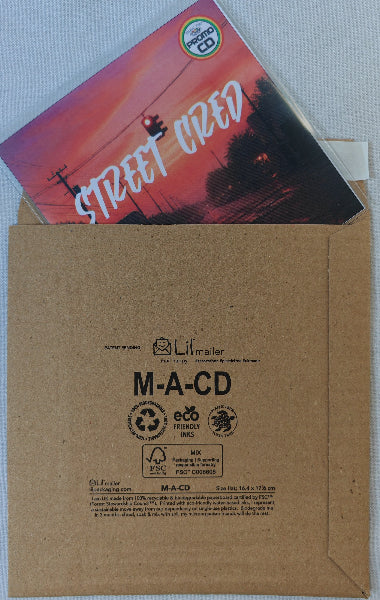 Kraft paper envelope with a CD and a colorful cover on a white background