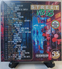 Thumbnail for CD cover with street scene and album tracklist on a stand