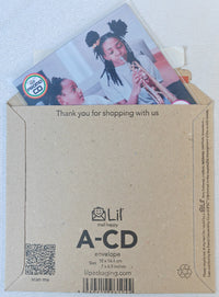 Thumbnail for Kraft paper envelope with a photo of two children and a card inside, on a light blue background.