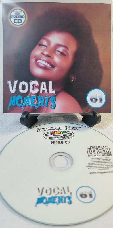 Promo CD with a woman's face on the cover titled 'Vocal Moments' and 'Reggae Nest' branding.